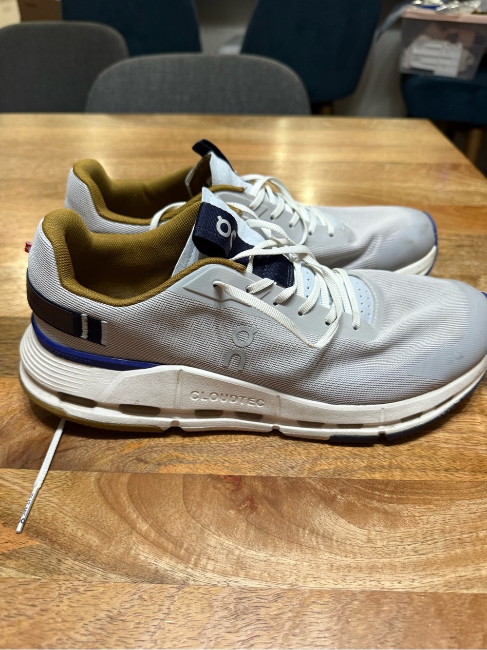 On Running Men's White Athletic Sneakers with Navy and Olive Accents